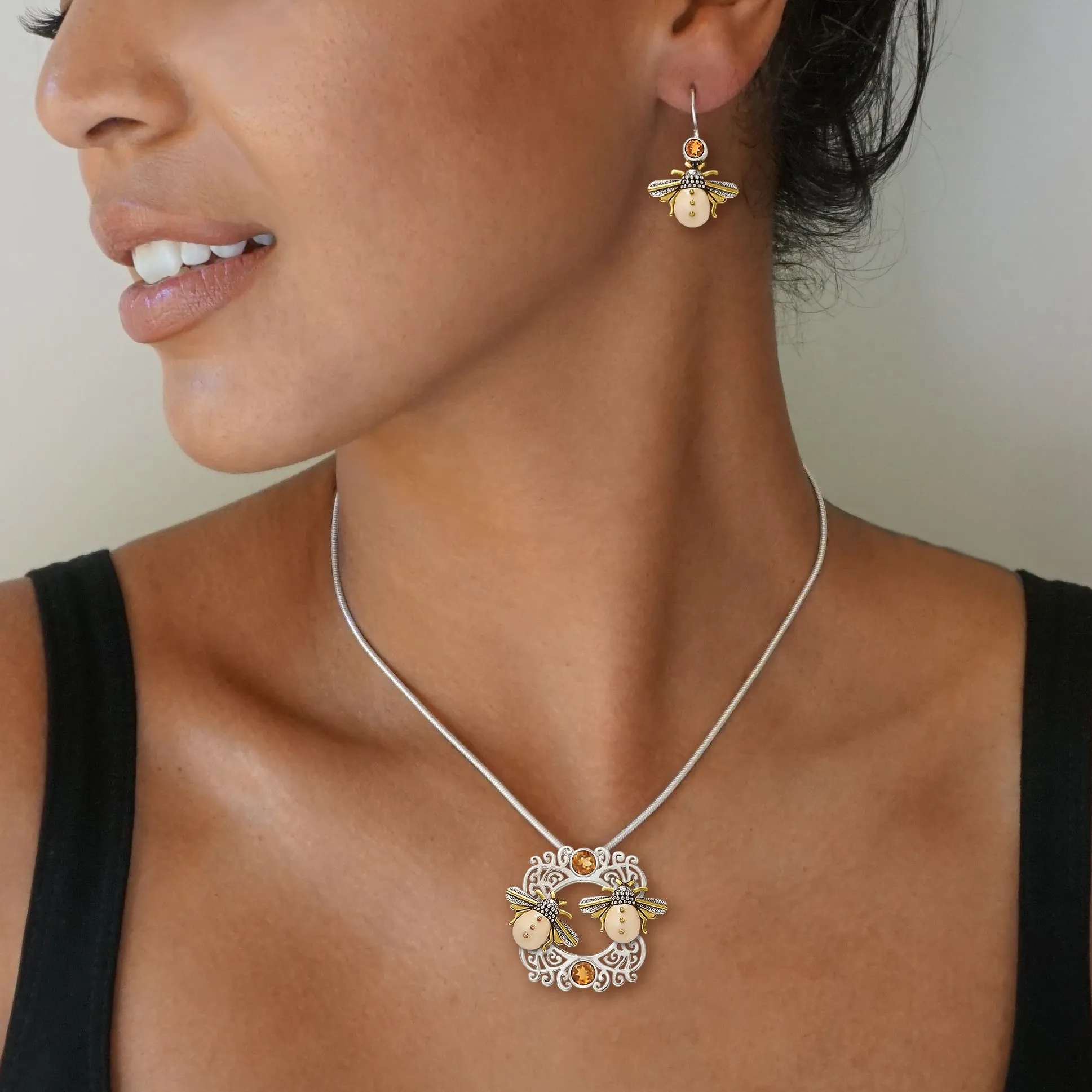 FOSSILIZED WALRUS IVORY AND SILVER PENDANT - SUN KISSED BEES